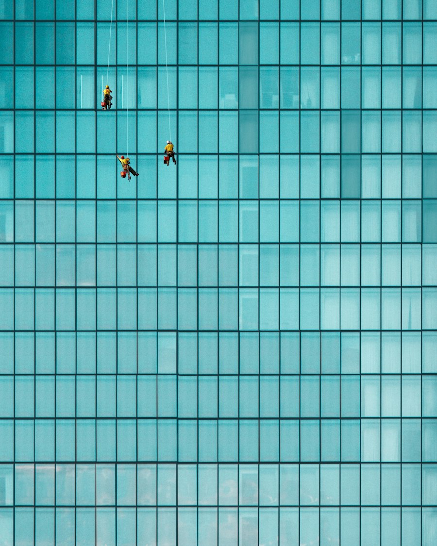 Rope access cleaners on a glass facade